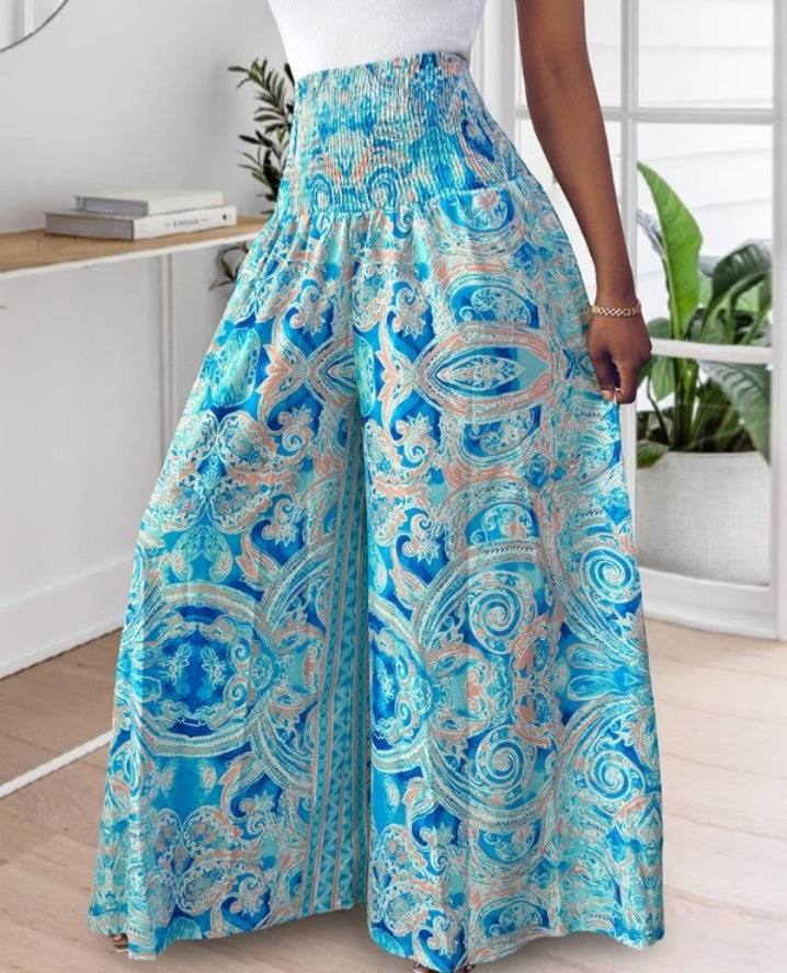 Premièrement : Le Pantalon larges , taille haute, à imprimé tropical femme, est la pièce parfaite pour insuffler une touche d’exotisme à votre garde-robe.