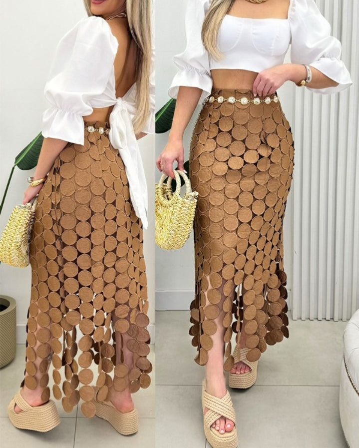Premièrement : Cette Jupe longue moulante à pompons style bohème ajouré Femme.