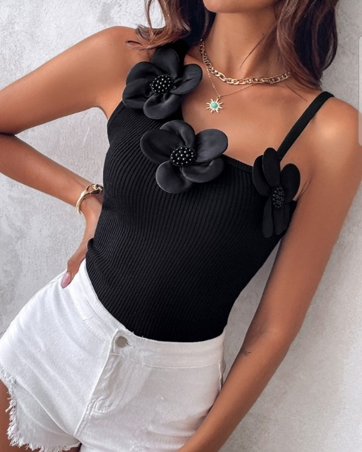 Premièrement : Ce 1 débardeur en tricot à motif floral et perles décoratives sans manches femme.