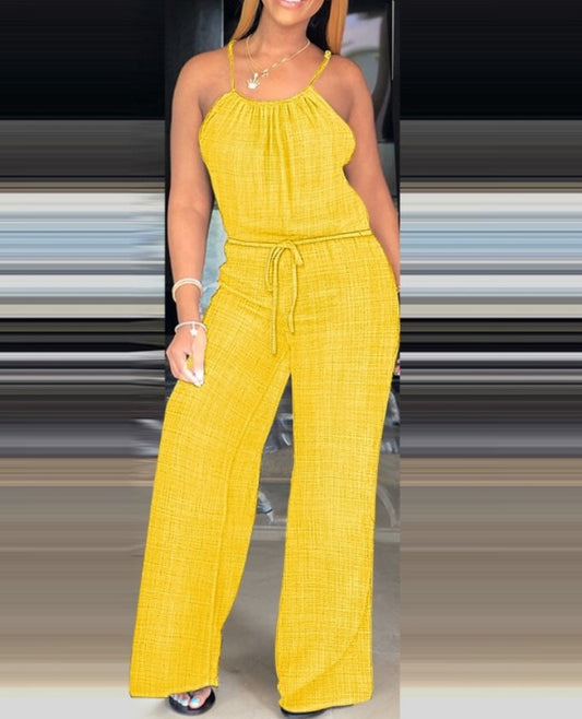 Premièrement : Adoptez un style chic et décontracté avec cette Combinaison courte décontractée à pois , et froncées sans manches avec détails noués et boutons décoratifs femme