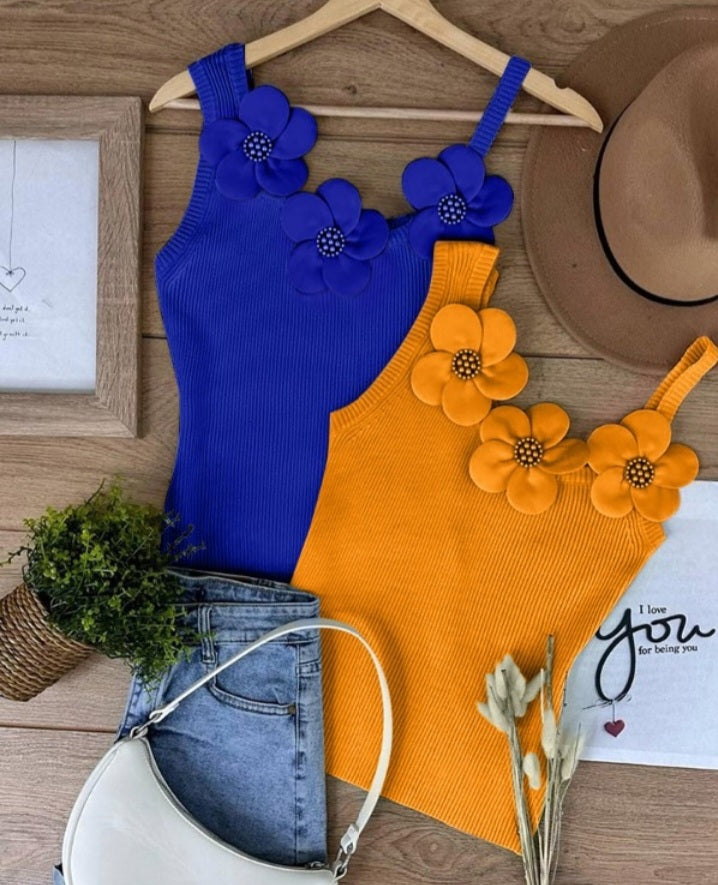 Premièrement : Ce 1 débardeur en tricot à motif floral et perles décoratives sans manches femme.