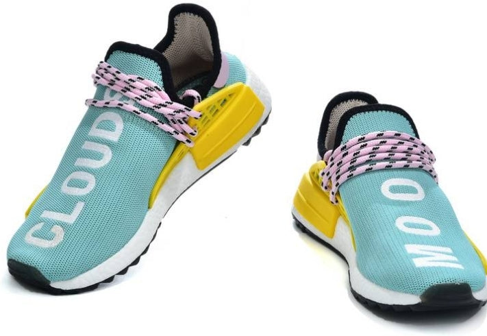 les baskets Adidas Human Race NMD x Pharrell Yellow " Femme sont un témoignage de l'engagement d'Adidas à combiner style et innovation.