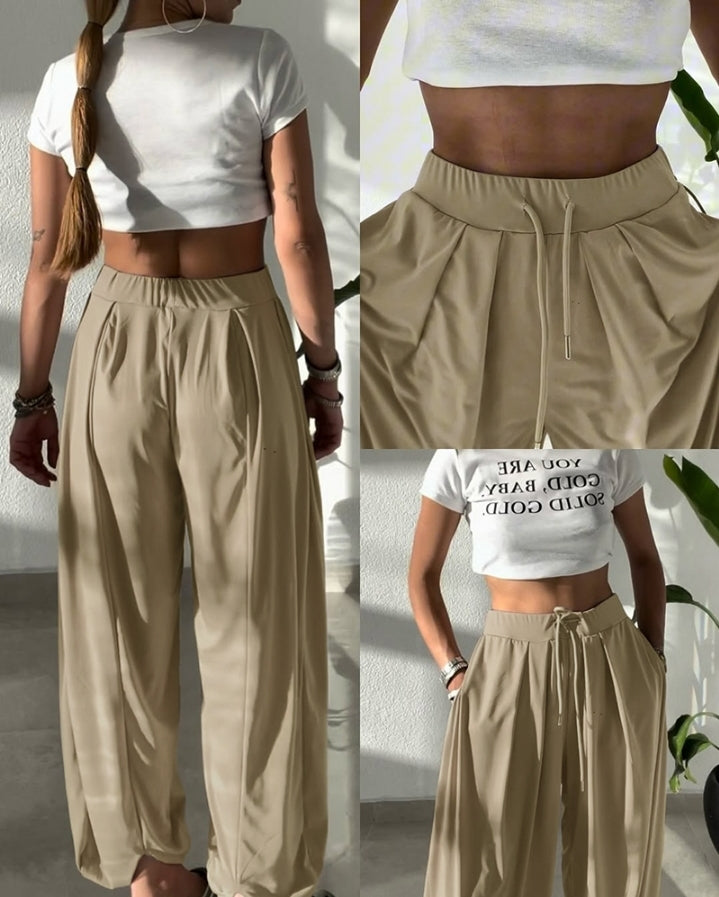 Premièrement : Ce Pantalon taille haute élastique à revers et cordon de serrage , coupe ample et décontractée , froncé Femme .