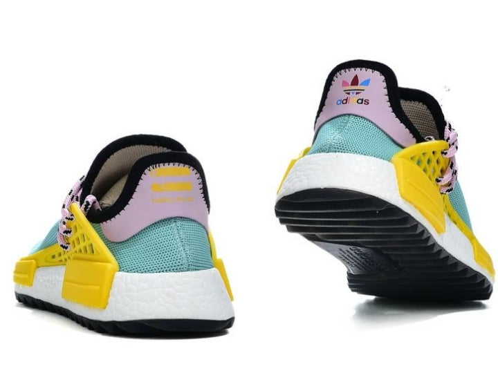 les baskets Adidas Human Race NMD x Pharrell Yellow " Femme sont un témoignage de l'engagement d'Adidas à combiner style et innovation.