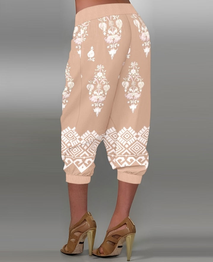 Premièrement : Ce Pantalon capri taille basse à imprimé plante tribales avec boutons décoratifs, pantalon de vacances avec poche femme .