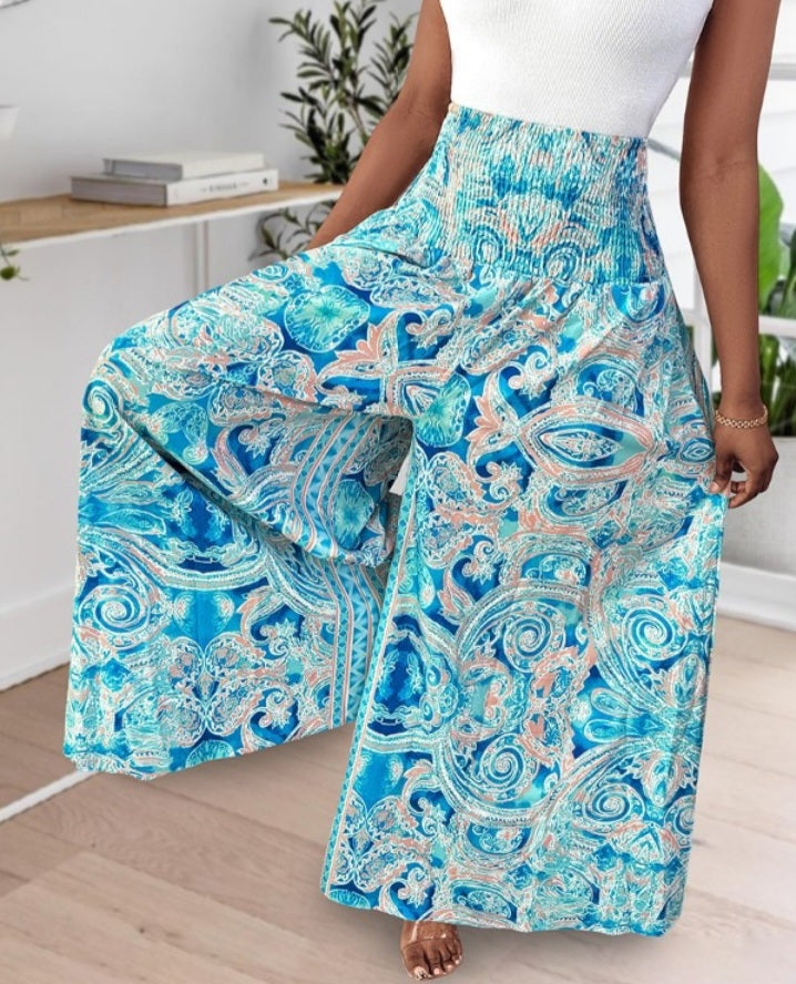Premièrement : Le Pantalon larges , taille haute, à imprimé tropical femme, est la pièce parfaite pour insuffler une touche d’exotisme à votre garde-robe.