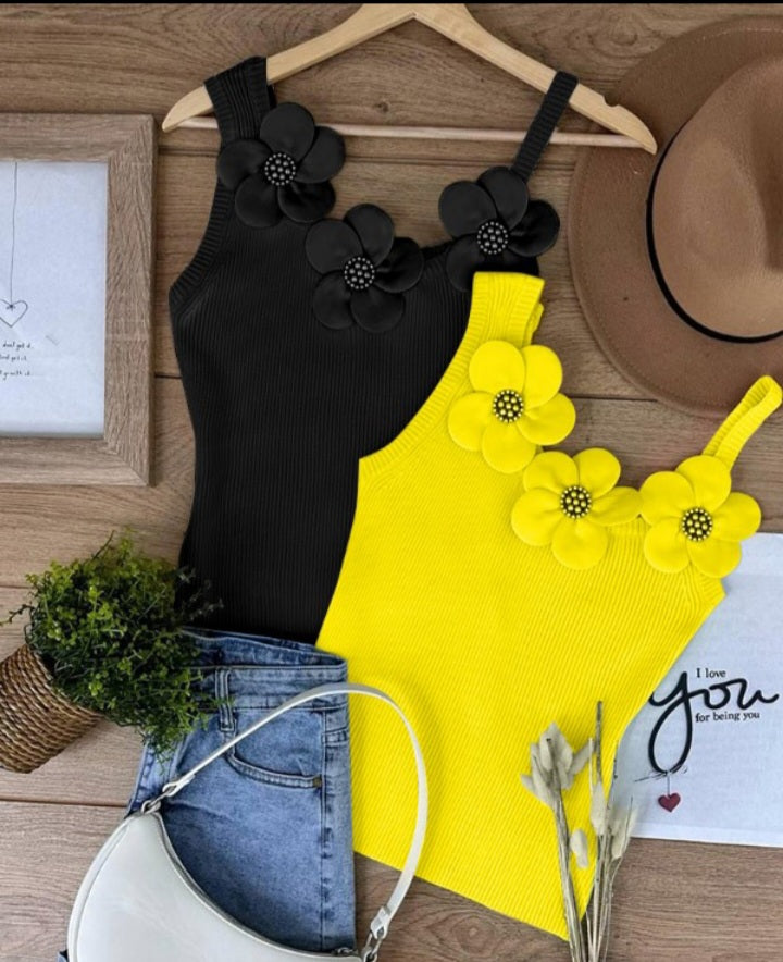Premièrement : Ce 1 débardeur en tricot à motif floral et perles décoratives sans manches femme.