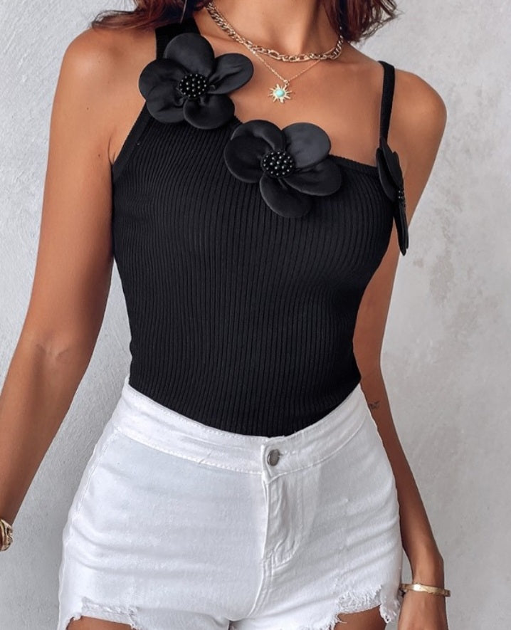 Premièrement : Ce 1 débardeur en tricot à motif floral et perles décoratives sans manches femme.