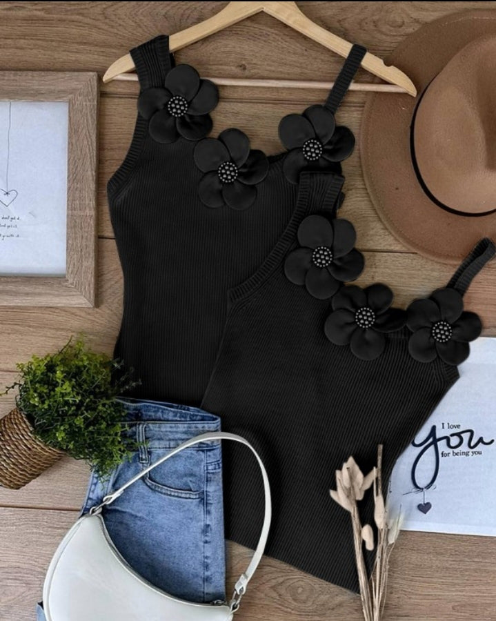 Premièrement : Ce 1 débardeur en tricot à motif floral et perles décoratives sans manches femme.