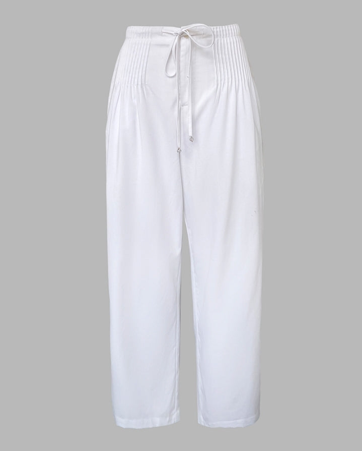 Premièrement : Ce Pantalon décontracté droit à cordons froncées Femme pour incarne l’équilibre parfait entre aisance et élégance au quotidien.