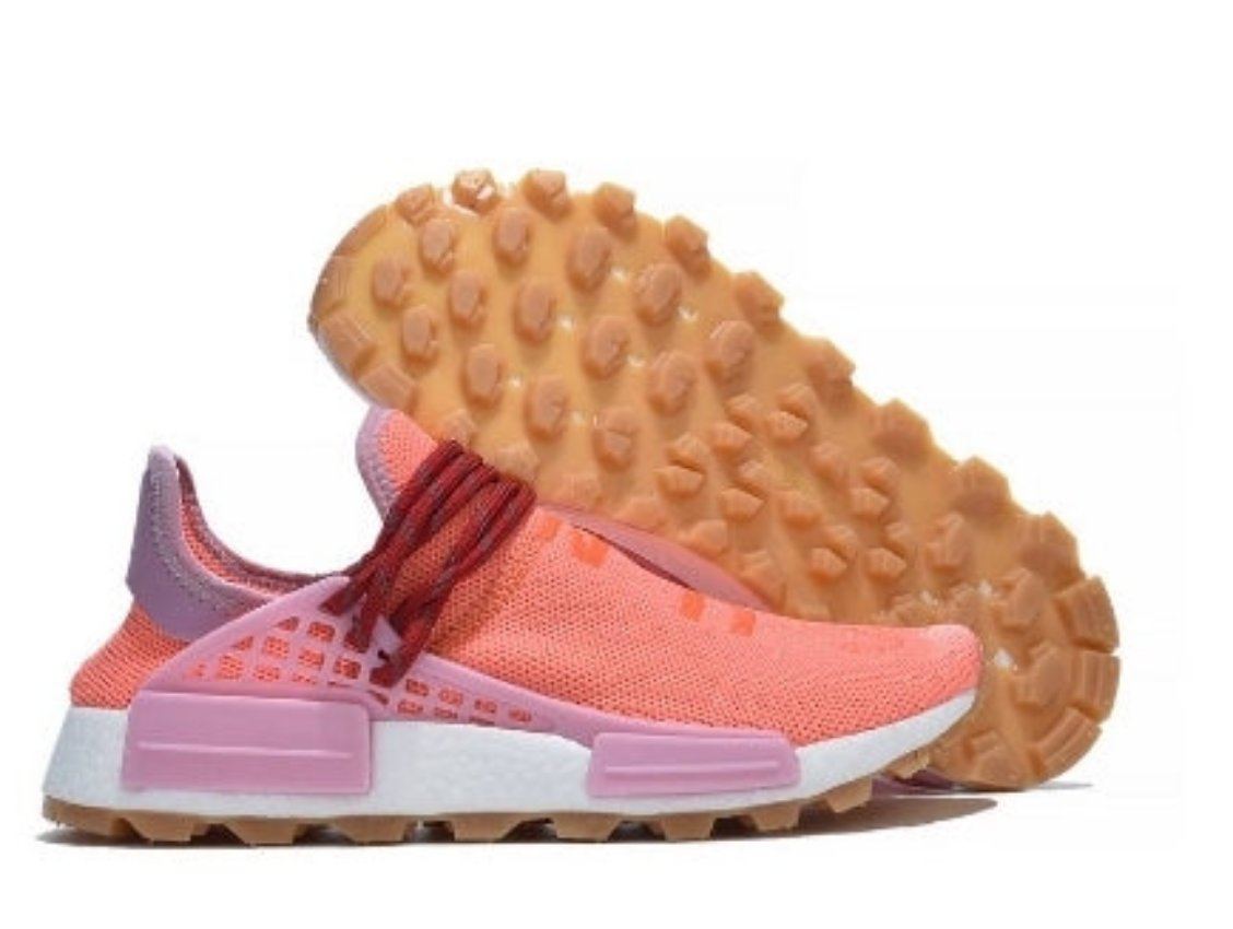 les baskets Adidas Human Race NMD x Pharrell Yellow " Femme  sont un témoignage de l'engagement d'Adidas à combiner style et innovation.