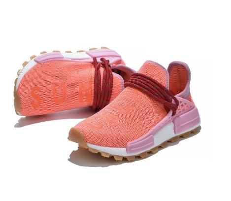 les baskets Adidas Human Race NMD x Pharrell Yellow " Femme  sont un témoignage de l'engagement d'Adidas à combiner style et innovation.
