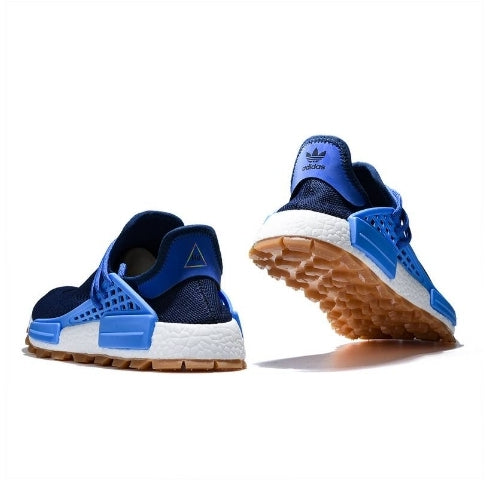 les baskets Adidas Human Race NMD x Pharrell Yellow " Femme sont un témoignage de l'engagement d'Adidas à combiner style et innovation.