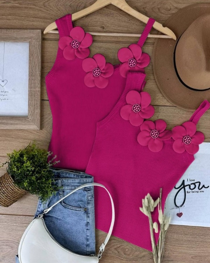 Premièrement : Ce 1 débardeur en tricot à motif floral et perles décoratives sans manches femme.