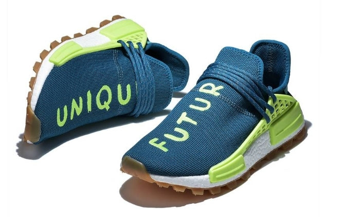 les baskets Adidas Human Race NMD x Pharrell Yellow " Femme  sont un témoignage de l'engagement d'Adidas à combiner style et innovation.