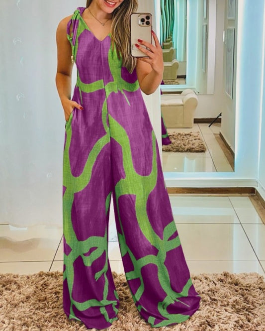 Premièrement : Apportez une touche de fraîcheur et de féminité à votre garde-robe avec cette Combinaison à imprimé floral, col en V, bretelles à lacets , style décontracté avec poches Femme.