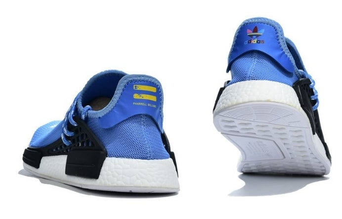 les baskets Adidas Human Race NMD x Pharrell Yellow " Femme  sont un témoignage de l'engagement d'Adidas à combiner style et innovation.