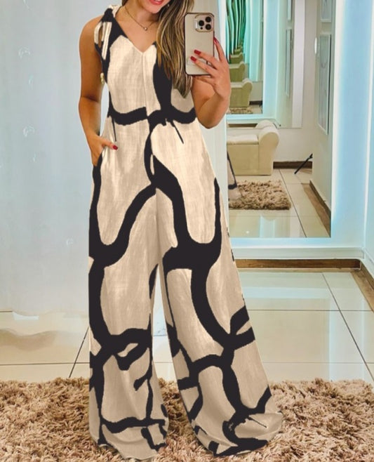 Premièrement : Apportez une touche de fraîcheur et de féminité à votre garde-robe avec cette Combinaison à imprimé floral, col en V, bretelles à lacets , style décontracté avec poches Femme.
