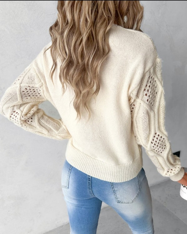 Openwork knit sweater with high neck