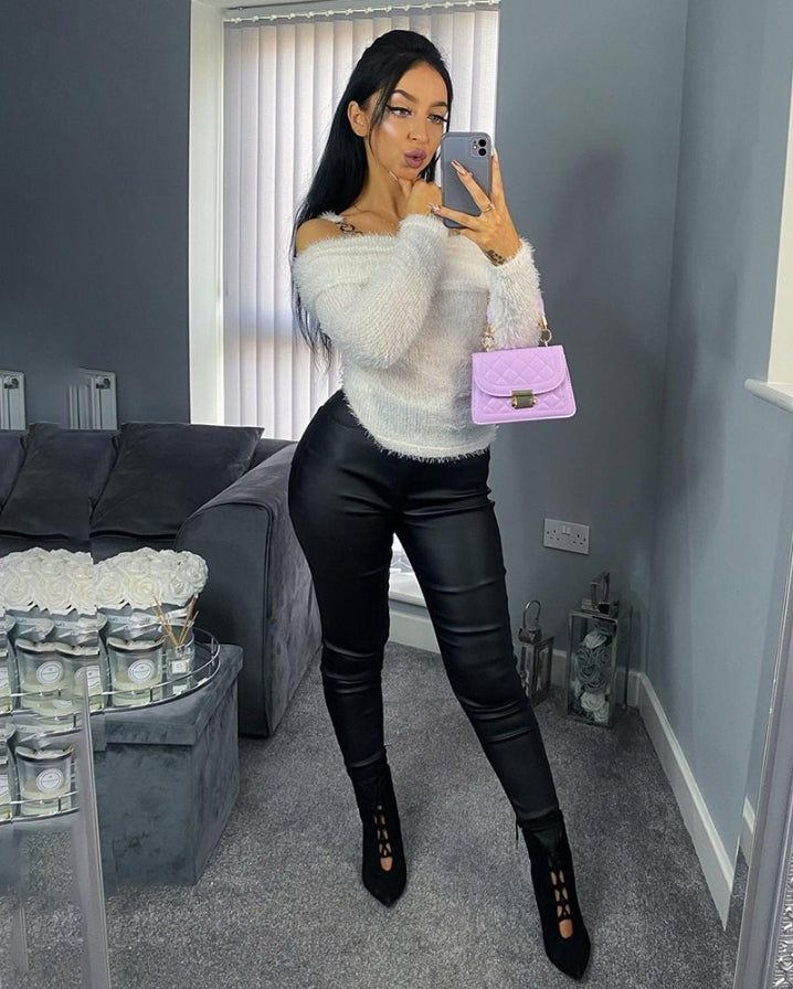 Soft knit sweater with off-the-shoulder and chain decoration