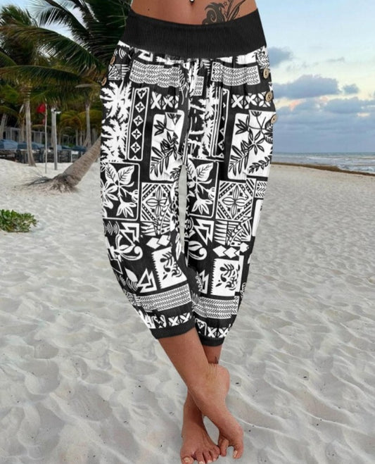 Premièrement : Ce Pantalon capri taille basse à imprimé plante tribales avec boutons décoratifs, pantalon de vacances avec poche femme .