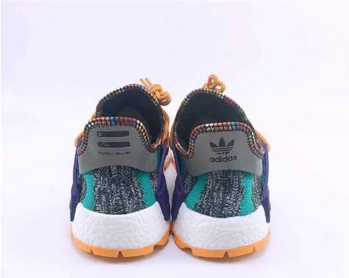 les baskets Adidas Human Race NMD x Pharrell Yellow " Femme  sont un témoignage de l'engagement d'Adidas à combiner style et innovation.