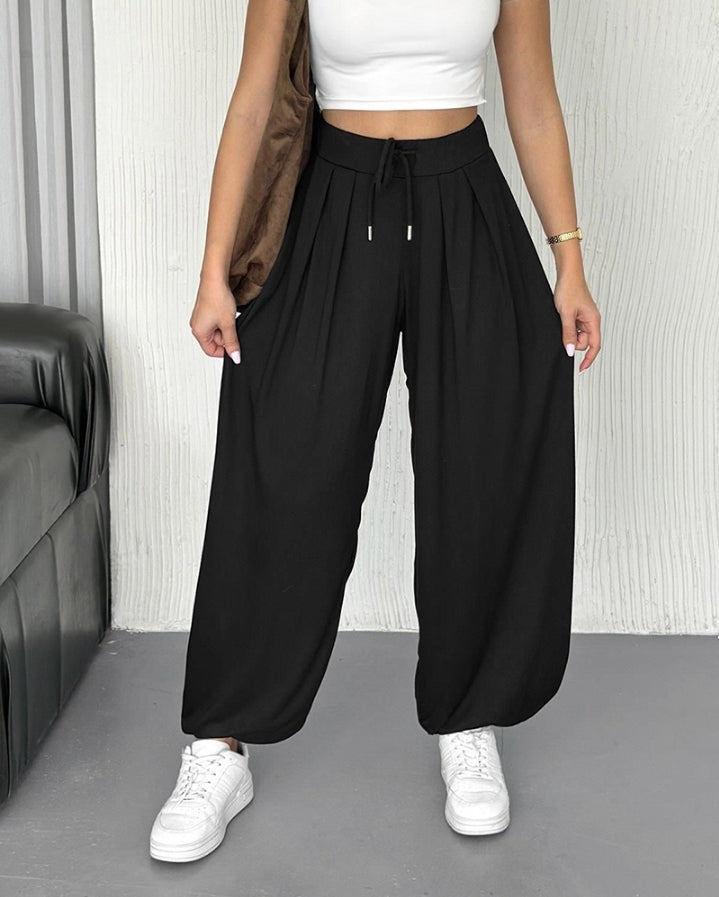 Premièrement : Ce Pantalon taille haute élastique à revers et cordon de serrage , coupe ample et décontractée , froncé Femme .