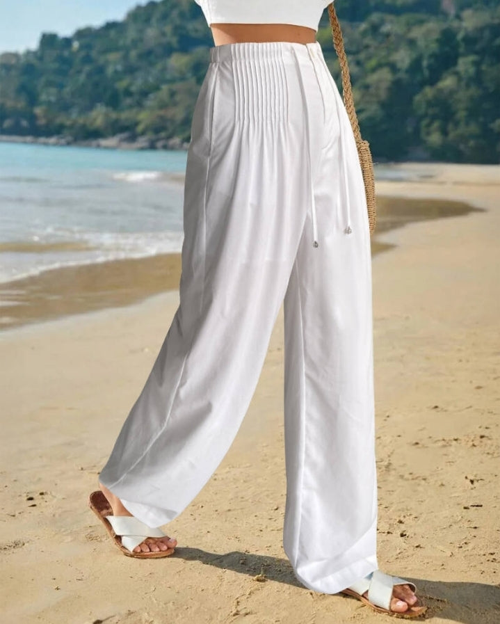 Premièrement : Ce Pantalon décontracté droit à cordons froncées Femme pour incarne l’équilibre parfait entre aisance et élégance au quotidien.