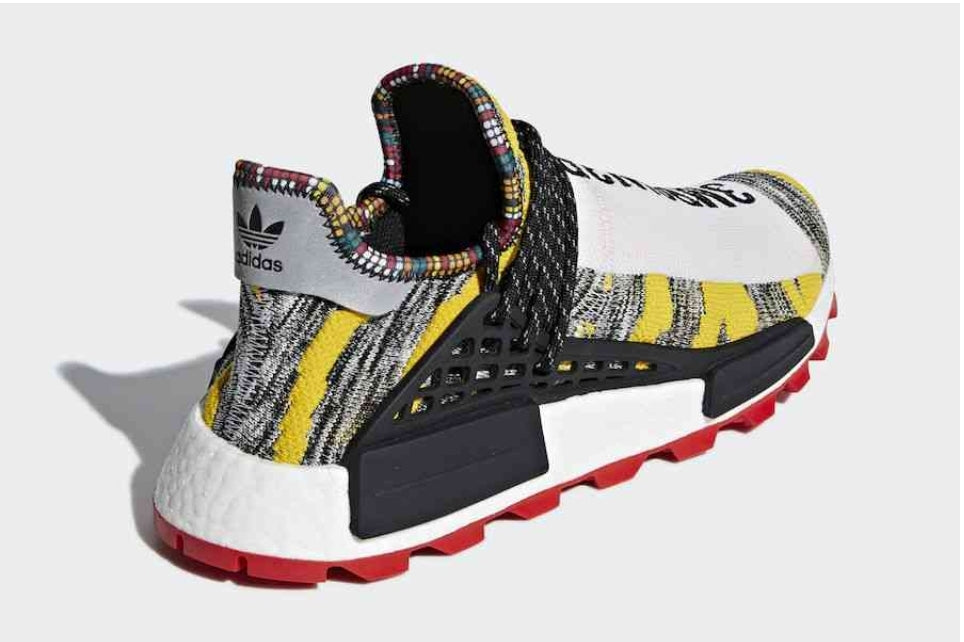 les baskets Adidas Human Race NMD x Pharrell Yellow " Femme  sont un témoignage de l'engagement d'Adidas à combiner style et innovation.