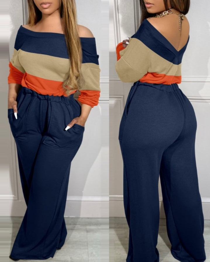 Premièrement : La Combinaison à manches longues et épaules dénudées à blocs se couleurs , dos en V , taille extensible, design , avec poches Femme