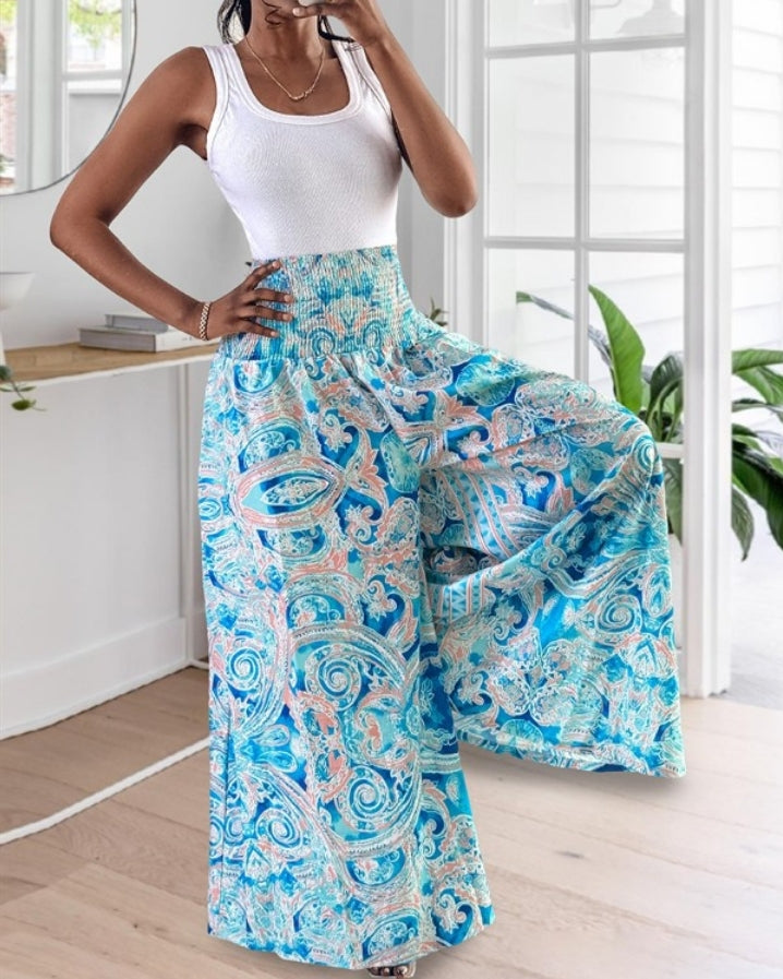 Premièrement : Le Pantalon larges , taille haute, à imprimé tropical femme, est la pièce parfaite pour insuffler une touche d’exotisme à votre garde-robe.