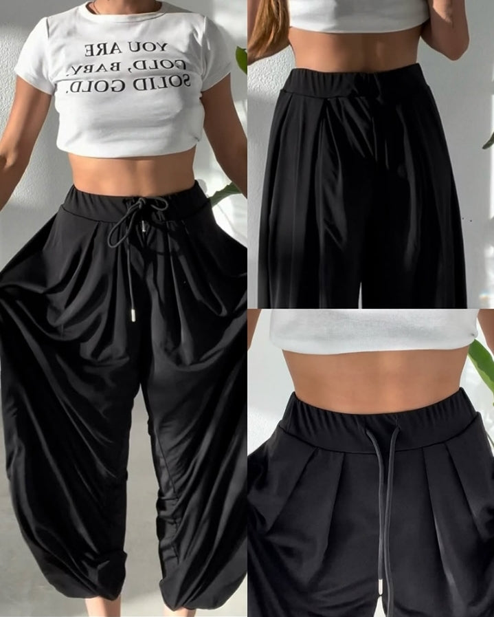 Premièrement : Ce Pantalon taille haute élastique à revers et cordon de serrage , coupe ample et décontractée , froncé Femme .