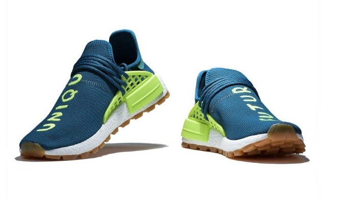les baskets Adidas Human Race NMD x Pharrell Yellow " Femme  sont un témoignage de l'engagement d'Adidas à combiner style et innovation.