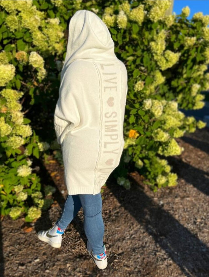 Long knitted cardigan with hood and heart print