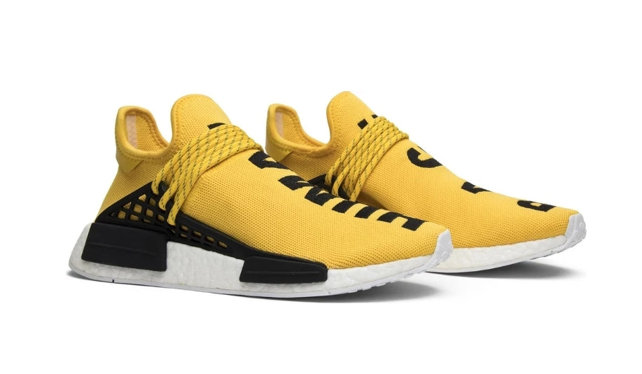 les baskets Adidas Human Race NMD x Pharrell Yellow " Femme  sont un témoignage de l'engagement d'Adidas à combiner style et innovation.