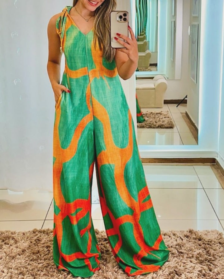 Premièrement : Apportez une touche de fraîcheur et de féminité à votre garde-robe avec cette Combinaison à imprimé floral, col en V, bretelles à lacets , style décontracté avec poches Femme.