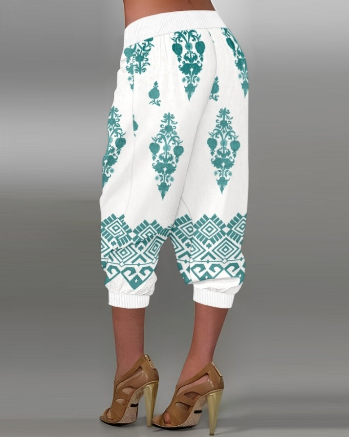 Premièrement : Ce Pantalon capri taille basse à imprimé plante tribales avec boutons décoratifs, pantalon de vacances avec poche femme .