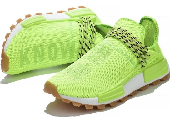 les baskets Adidas Human Race NMD x Pharrell Yellow " Femme  sont un témoignage de l'engagement d'Adidas à combiner style et innovation.