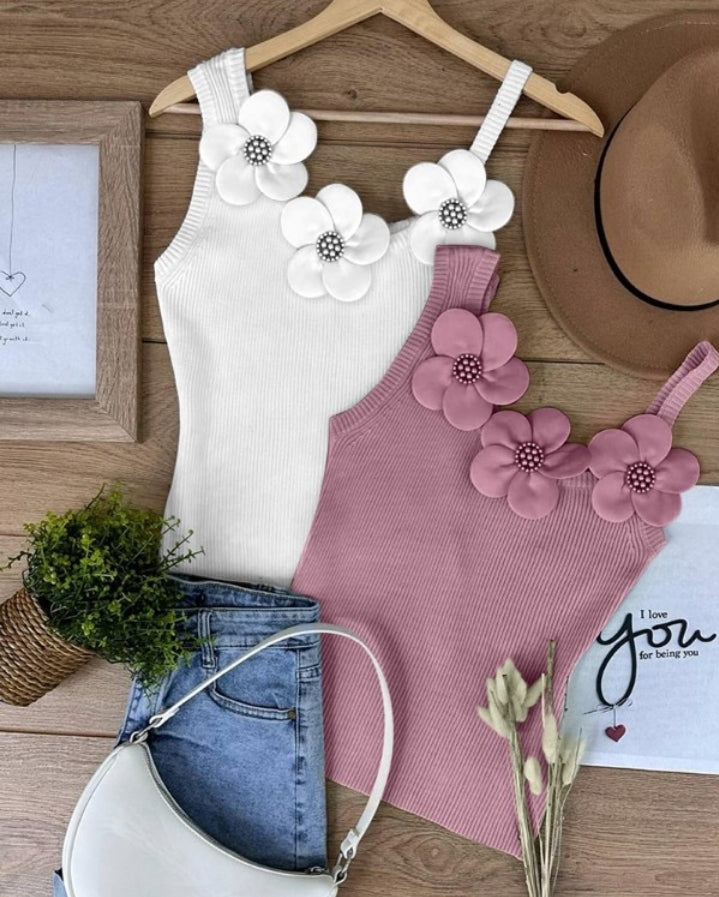 Premièrement : Ce 1 débardeur en tricot à motif floral et perles décoratives sans manches femme.