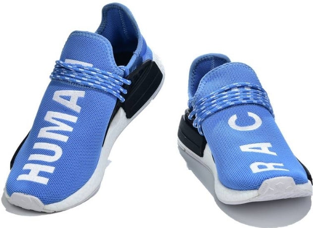 les baskets Adidas Human Race NMD x Pharrell Yellow " Femme  sont un témoignage de l'engagement d'Adidas à combiner style et innovation.