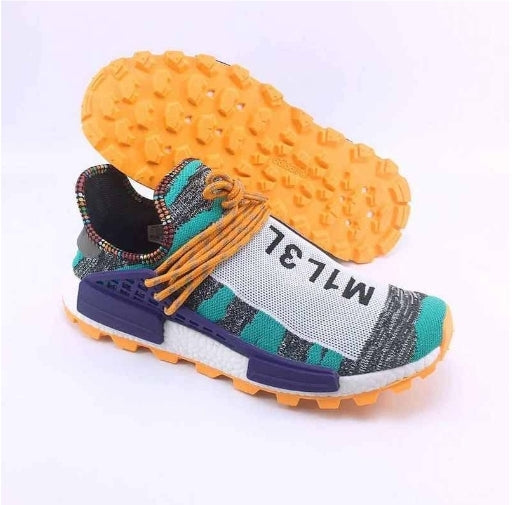 les baskets Adidas Human Race NMD x Pharrell Yellow " Femme  sont un témoignage de l'engagement d'Adidas à combiner style et innovation.