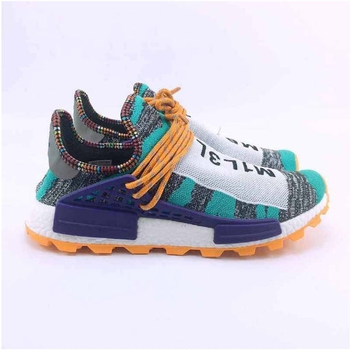 les baskets Adidas Human Race NMD x Pharrell Yellow " Femme  sont un témoignage de l'engagement d'Adidas à combiner style et innovation.