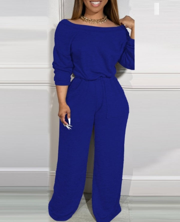 Premièrement : Laissez-vous séduire par le charme de cette Combinaison à épaules dénudées et dos en V avec poches à la taille extensible femme.