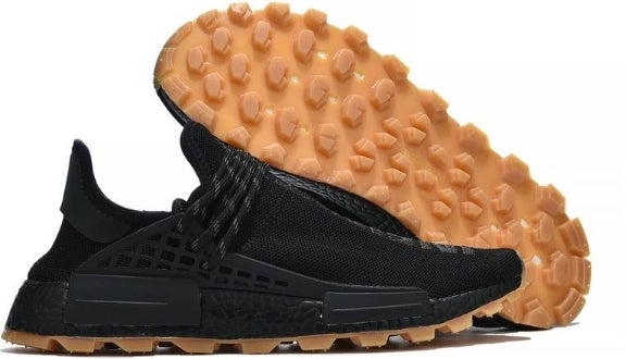 les baskets Adidas Human Race NMD x Pharrell Yellow " Femme  sont un témoignage de l'engagement d'Adidas à combiner style et innovation.