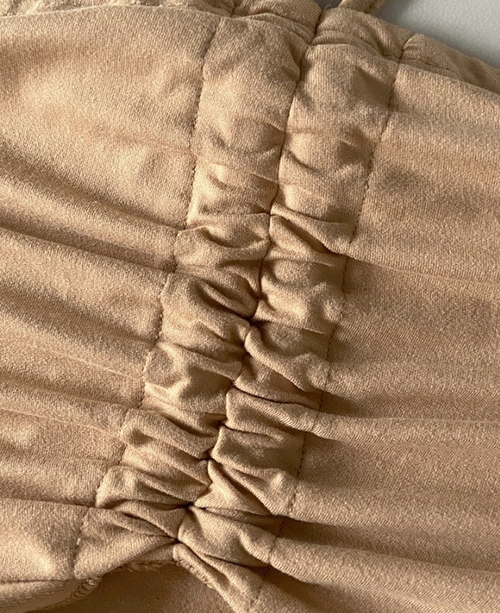 Premièrement : Ce Haut long sans manches à col licou et bandeau froncé style décontracté Femme.