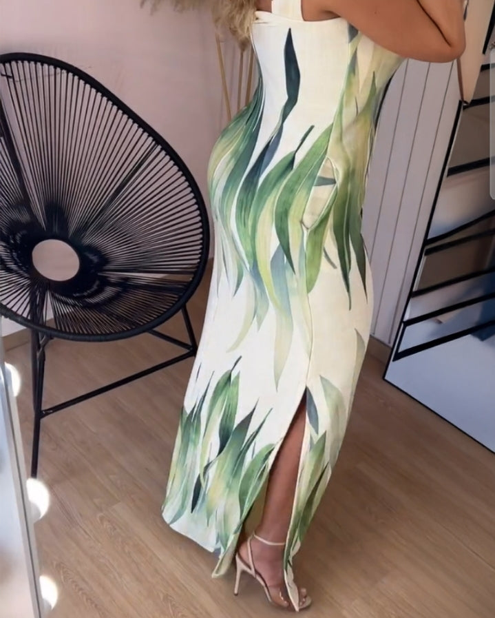 Premièrement : Cette robe longue décontractée à bretelles épaisses et imprimé végétal, coupe ajustée et fendue avec poches Femme.