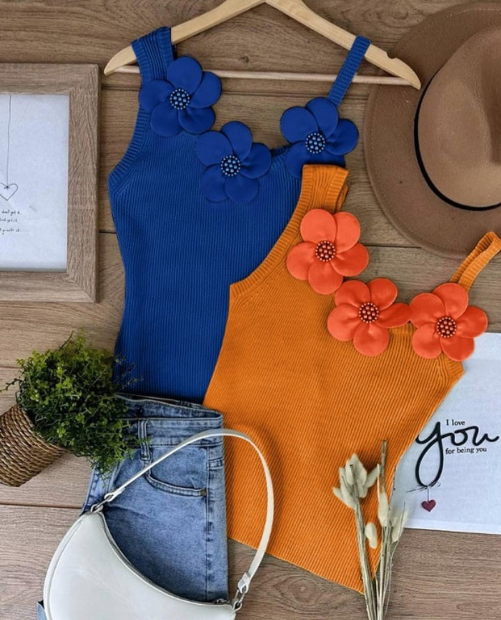 Premièrement : Ce 1 débardeur en tricot à motif floral et perles décoratives sans manches femme.