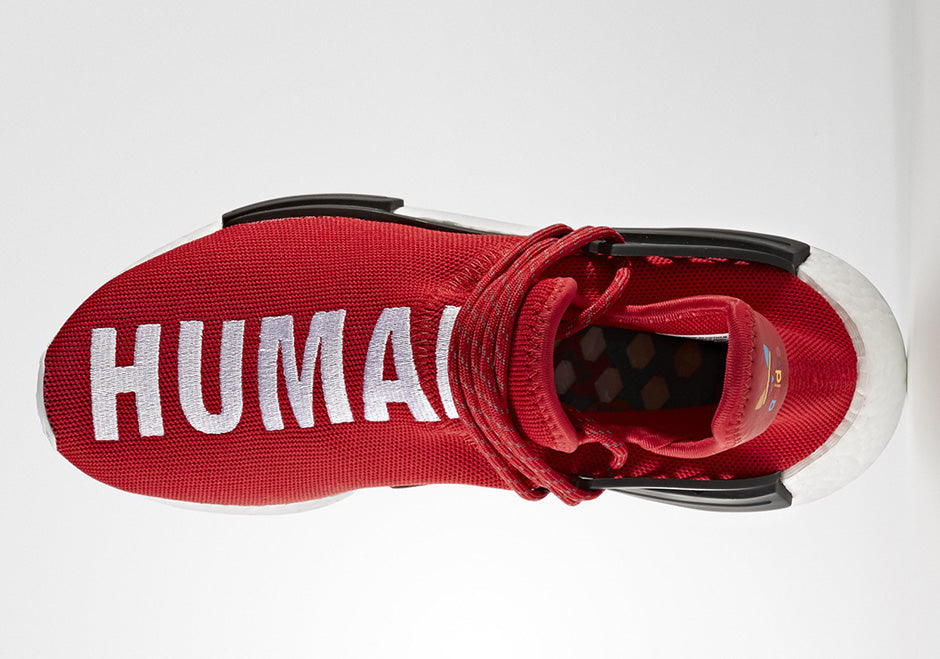 les baskets Adidas Human Race NMD x Pharrell Yellow " Femme  sont un témoignage de l'engagement d'Adidas à combiner style et innovation.