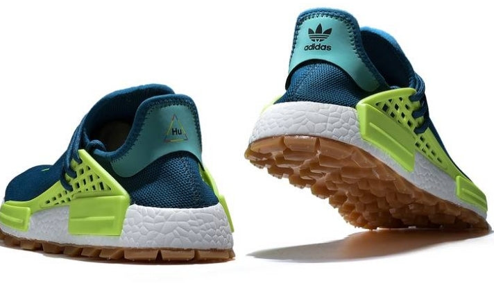 les baskets Adidas Human Race NMD x Pharrell Yellow " Femme  sont un témoignage de l'engagement d'Adidas à combiner style et innovation.