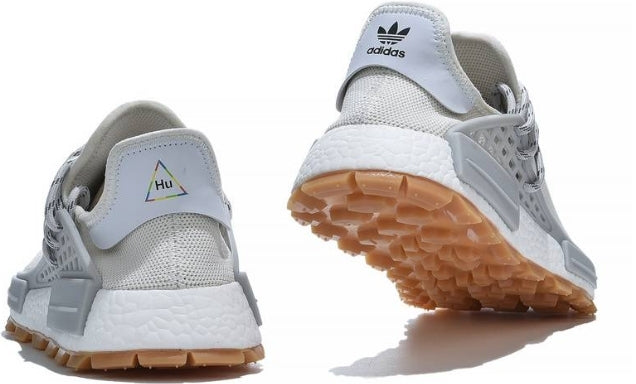 les baskets Adidas Human Race NMD x Pharrell Yellow " Femme  sont un témoignage de l'engagement d'Adidas à combiner style et innovation.